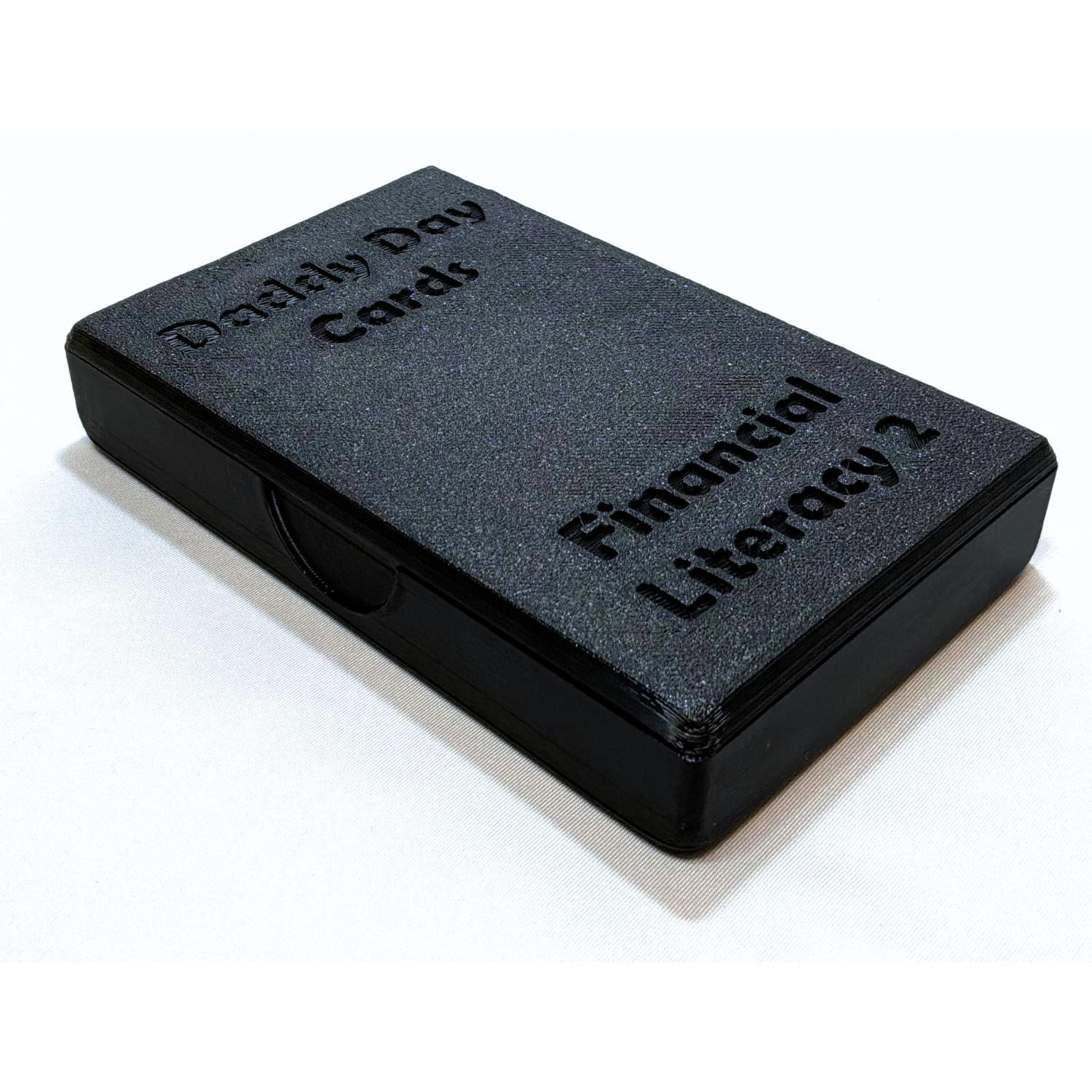Black card holder with playing cards on a white background